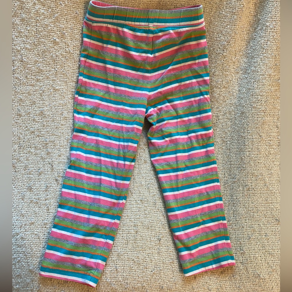 Striped green, pink, blue, green, grey, and white tights